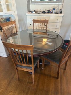 Real wood table with glass and 4 chairs