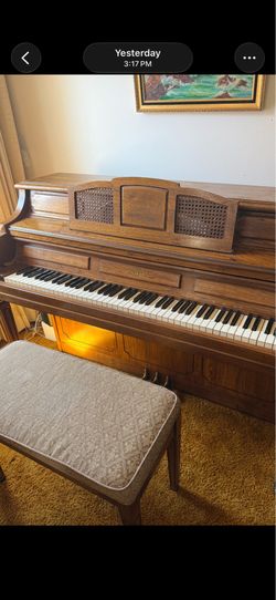 Piano with bench.