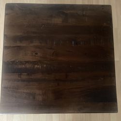 Square coffee table by Ashley Furniture