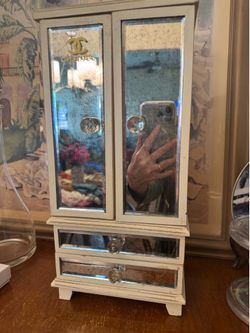 Mirrored Jewelry Armoire Cream Painted Wood with Antiqued Mirror Panels 17” x 7” x 5”.