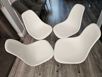Like new! A set of 4 chairs for dining room or office, Eames-style—featuring a timeless, clean, and minimalist modern design with a sophisticated, con