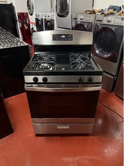 GE 4-burner gas stove in perfect working condition. Delivery and installation available with a 3-month warranty.