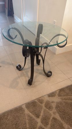 Glass side table with metal legs