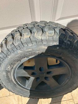 NEW AND NEVER USED RIM AND BF GOODRICH MUD TERRAIN TIRE