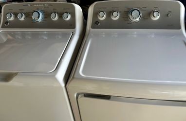 2 YEARS OLD. GE HE KING SIZE STAINLESS STEEL WASHER&ELECTRIC DRYER SET.