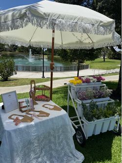 Flower bar umbrellas chairs tables