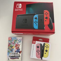 Nintendo Switch With  Extra Concrollers And Game! 