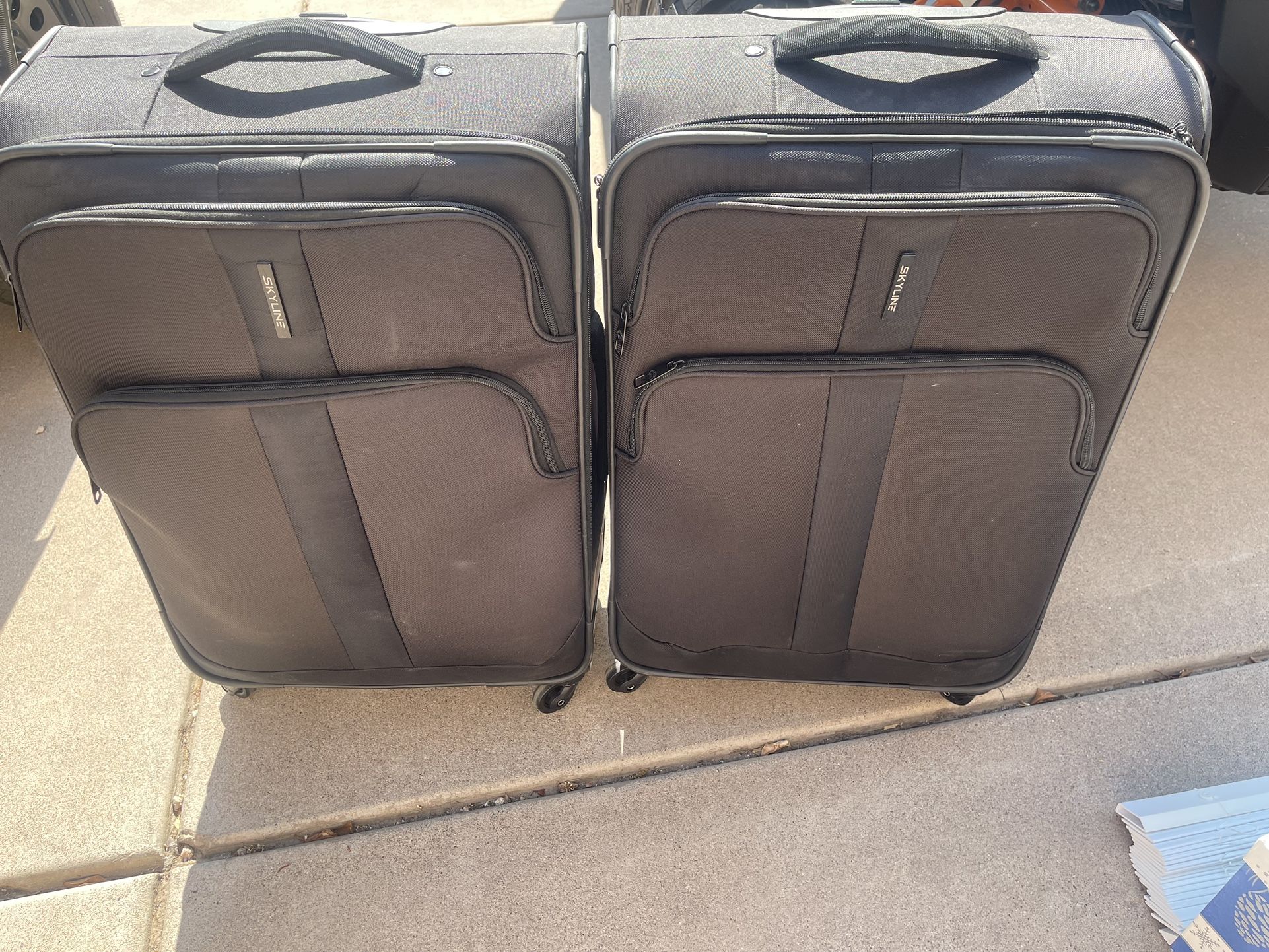 Two Skyline Suitcases