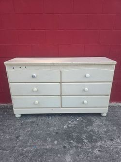 Used kids dresser, not real wood, the 6 drawers work good and are on track, compressed wood but sturdy and stable, great for a kids room, truck or suv