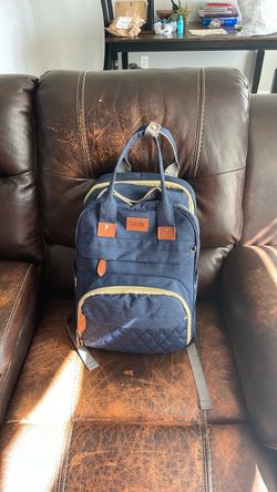 Navy blue diaper bag with changing station
