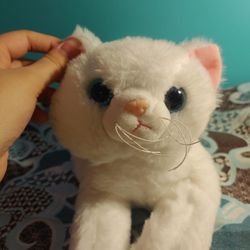 White cat stuffed animal embroidered paw pads