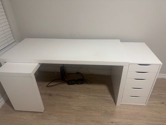 White IKEA desk and IKEA drawer unit.
