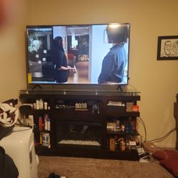 65 Inch Roku Smart TV With Fireplace Stand