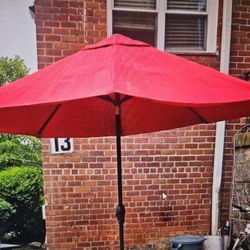 Outdoor patio umbrella with weighted bas