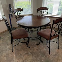 Ashley Furniture **wrought iron and wood** round breakfast/dining table set with four chairs