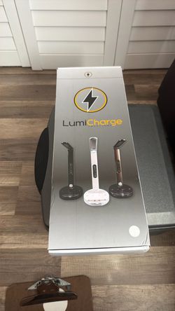 LumiCharge II All-in-One LED Desk Lamp, featuring a multi-functional design with a built-in phone charging dock, digital calendar display, and adjusta
