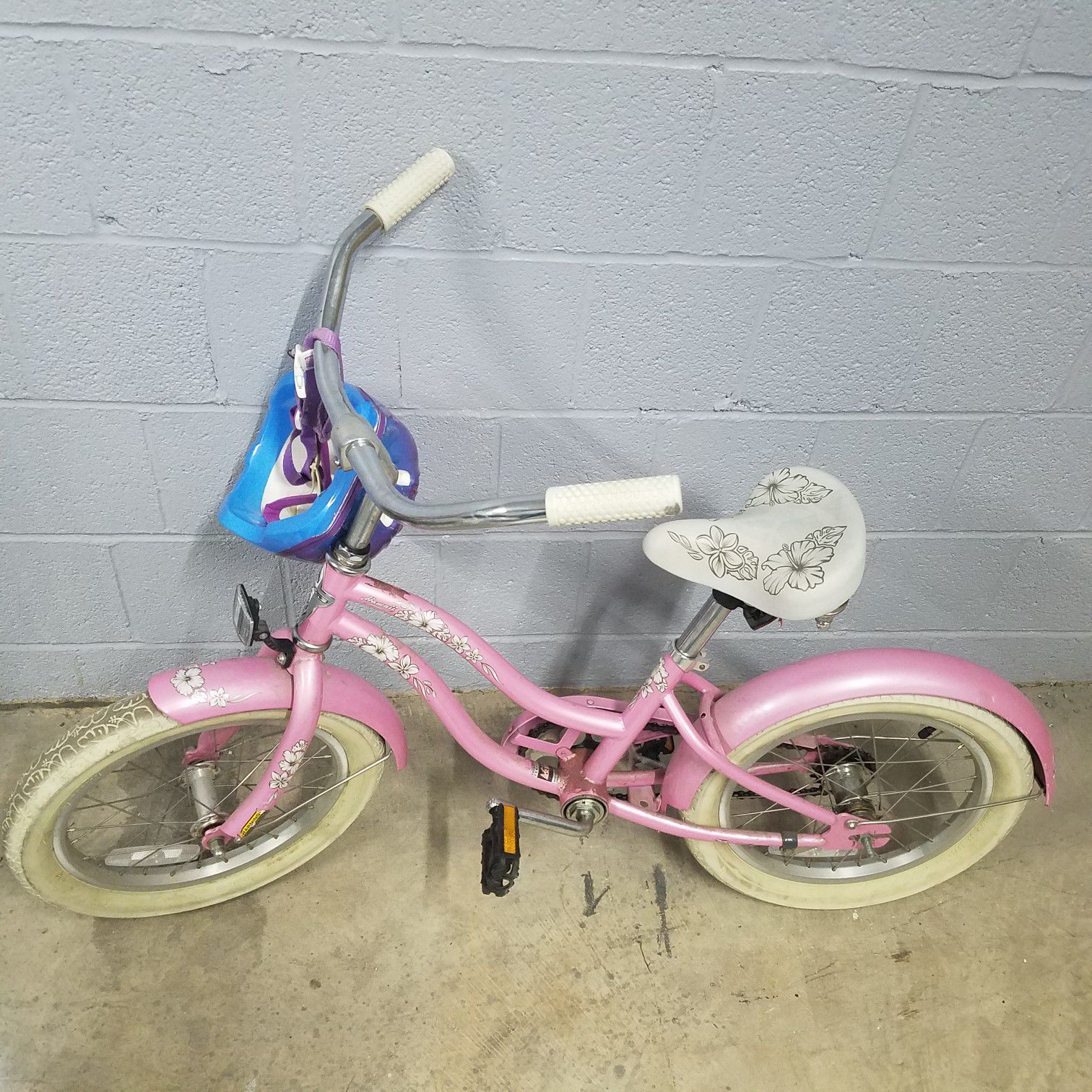 Girls 16" Electra Bike, Pink Hawaiian Style. Has heavy duty training wheels and helmet