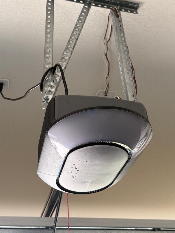 Garage door opener Chamberlane. With garage door frame and spring. Backup power and remotes.