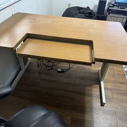 Large office desk with adjustable keyboard tray