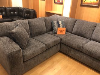 Grey Fabric Sectional Sofa with throw pillows