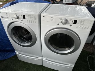 LG Tromm Super Capacity Direct Drive System, Stainless Steel Drum, Quiet Operation Washer & electric Dryer on pedestals!