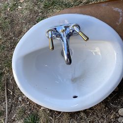 Bathroom sink with facet