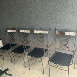 (4) wrought iron patio chairs