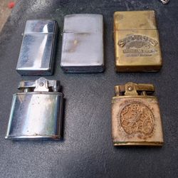 2 Vintage Zippo Lighters One Buxton Leather Wrapped Made In Japan & the 1938 Sturgis Bike Week Lighter Whole Collection 100$
