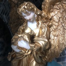 Angel And Blue Vase