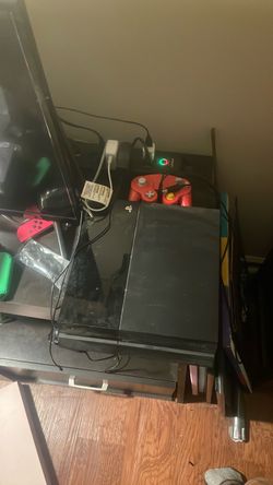 Used PlayStation 4 (with controllers and power cable)