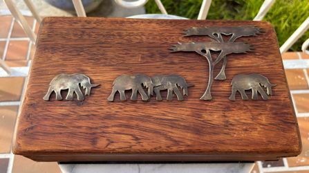 Vintage Wooden Jewelry Box featuring several brass elephants & 2 trees over natural wood grain.
