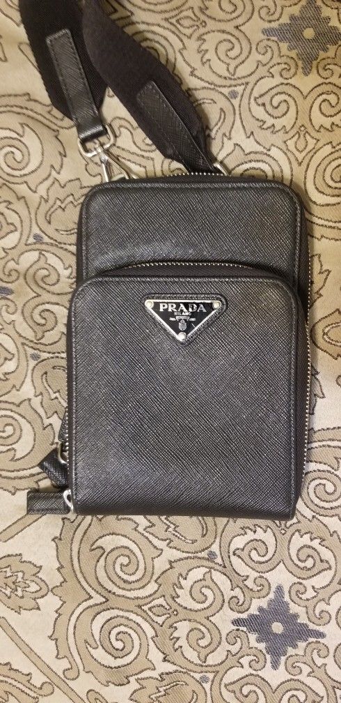 Prada messenger bag.