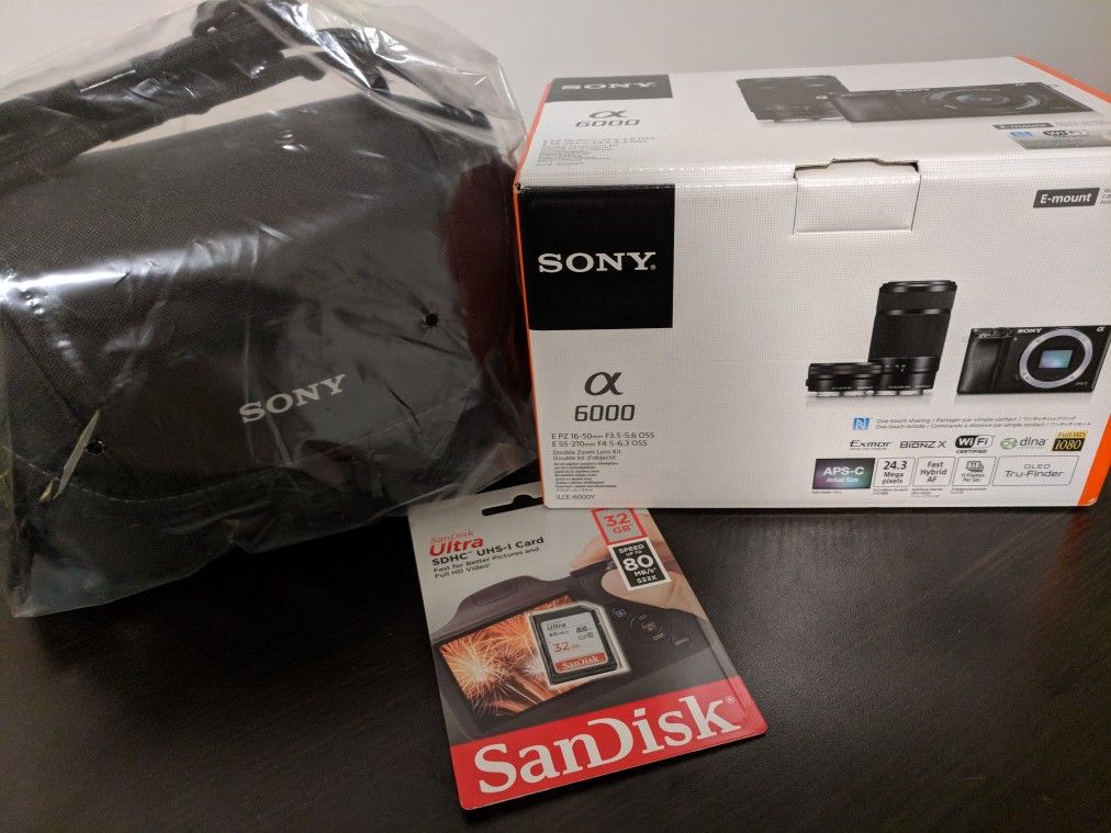 Brand New NIB Sony a6000 with 16-50 and 55-210 lens, camera bag, and 32gb SD card