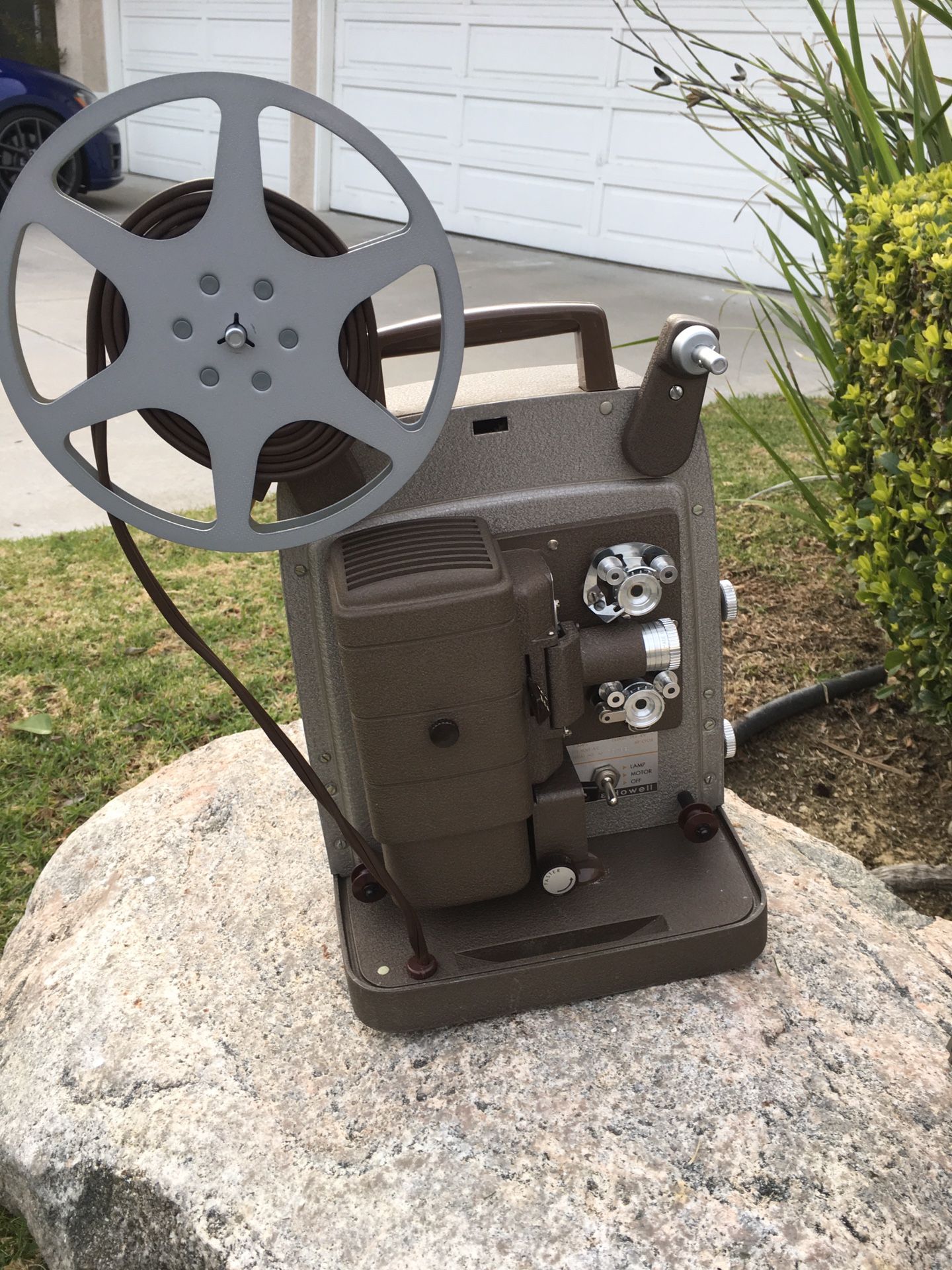 8mm movie camera and screen on the tripod