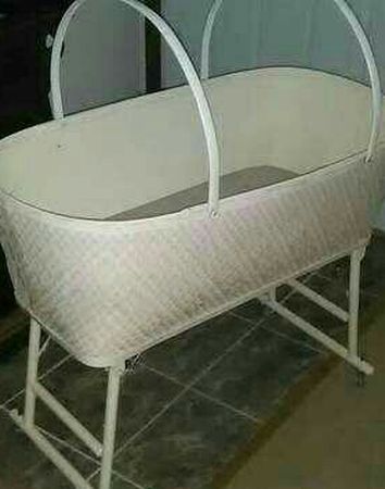 Vintage Redmon Baby wicker bassinet on wheels