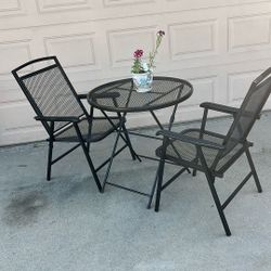 Metal table and two chairs