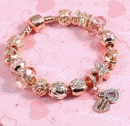 New 18 k rose gold bracelet with charms