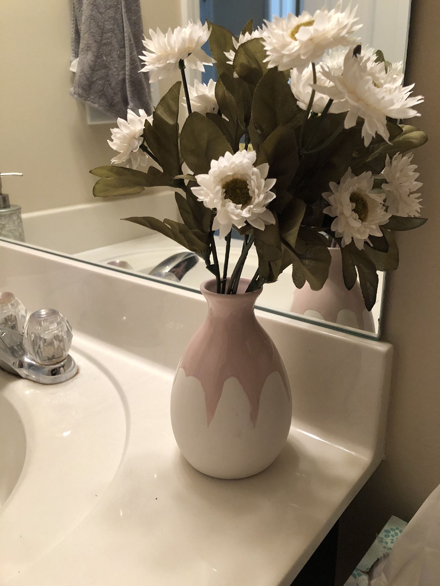 Vase with artificial flowers