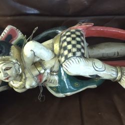 Vintage hand-carved Balinese wood sculpture depicting a dramatic mythological scene inspired by Rahu, the eclipse demon from Hindu-Buddhist mythology.