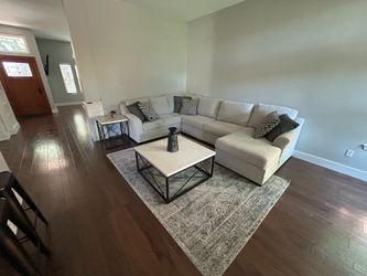 Sectional, side table, coffee table and rug