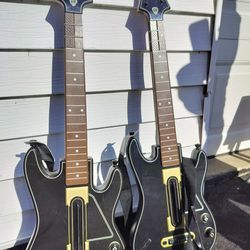 2 Guitar Hero Guitars 