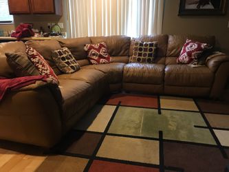 Pure leather sofa with two recliners