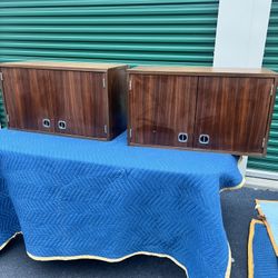 These are two mid-century modern walnut cabinets