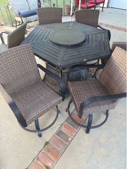 Used fire table and 6 swivel chairs