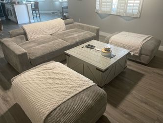 Sofa, two Ottomans and table