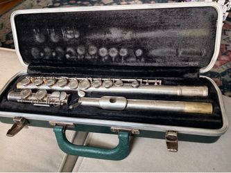 Used silver student flute with green case