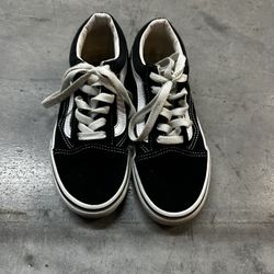 Stylish black and white Vans with white laces. Size 1.5 great condition
