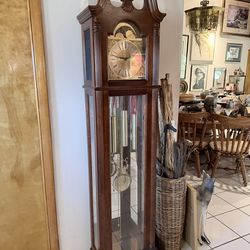 Howard Miller Electric Grandfather Clock In A Cherry Finish