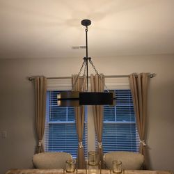 Modern Black and Gold Drum Chandelier. Less than a year oldModern drum chandelier has a dual-tone black and gold metal finish. The fixture is construc