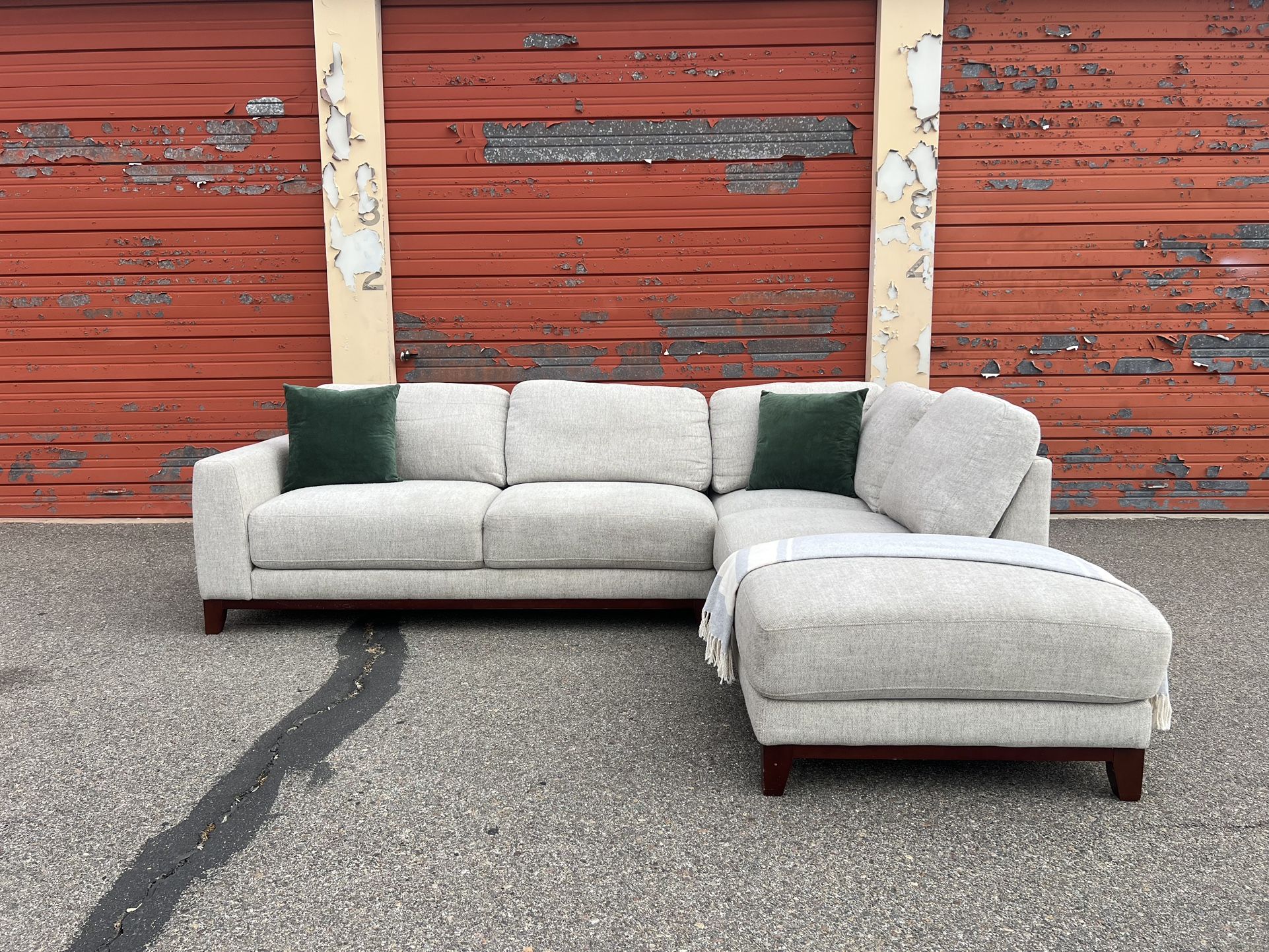 Gray Living Spaces sectional sofa couch with right facing chaise